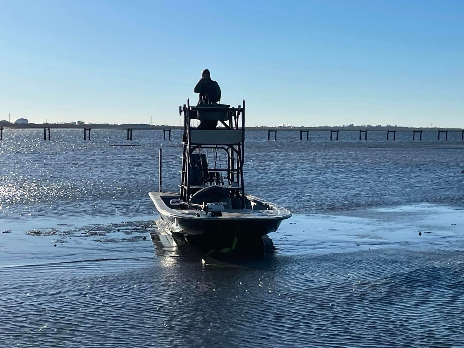 A TowBoatUS rescue boat with an operator in the elevated tower on Sabine Lake.