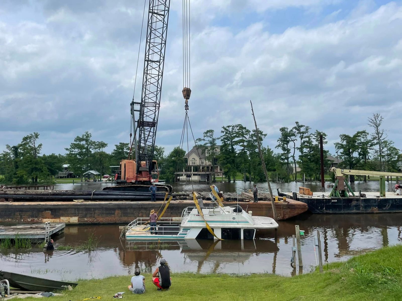 TowBoatUS Sabine Lake marine salvage and recovery operation on Sabine Lake with crane vessel and service boat.